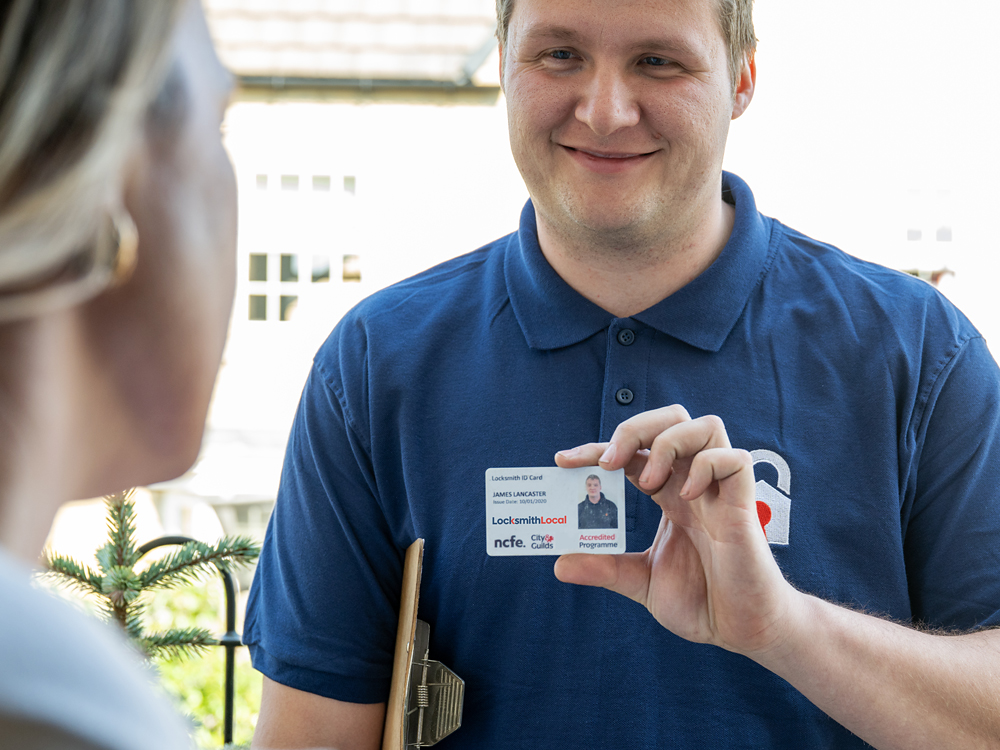 A vetted LocksmithLocal locksmith showing photo ID at the door