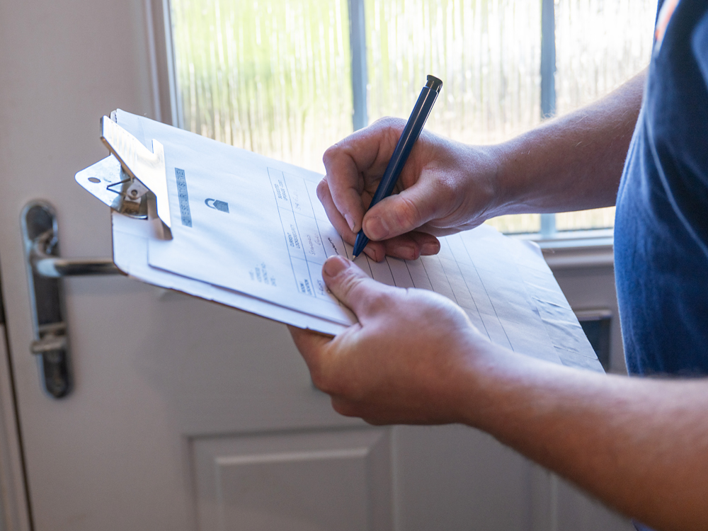 Recording findings on a home security survey form
