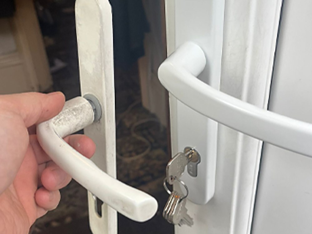 A repaired uPVC door handle working smoothly again
