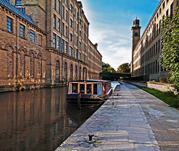 Salts Mill on the canal at Saltaire, the UNESCO World Heritage village in the Bradford district