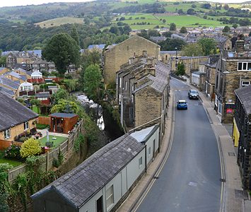 A view down into Mytholmroyd, the Calder Valley village set along its main street with the hills rising behind