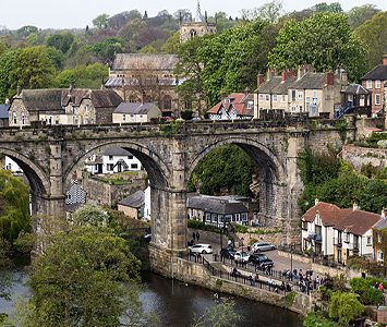 Knaresborough's houses climbing the gorge above the River Nidd, with the great railway viaduct and the church beyond