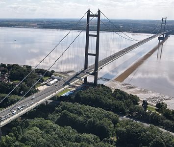 The Humber Bridge soaring over the estuary at Hessle, whose foreshore sits right beneath the bridge's northern tower — the Grade I listed crossing opened in 1981