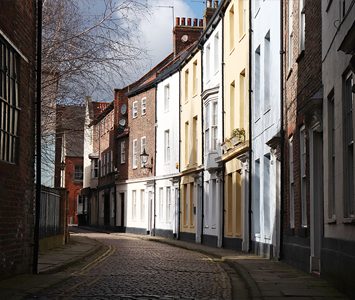 A quiet cobbled street of historic houses in Hull's Old Town, the atmospheric heart of the original walled town