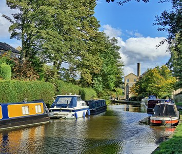 Moored narrowboats on the Leeds and Liverpool Canal, which runs through the Leeds area