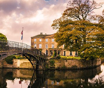 Walton Hall on its lake island, reached by the old iron footbridge — the estate where Charles Waterton created what is often called the world's first nature reserve