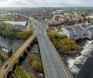 An aerial view over Wakefield city centre, with the River Calder, the historic Chantry Bridge and the angular Hepworth gallery on the waterfront